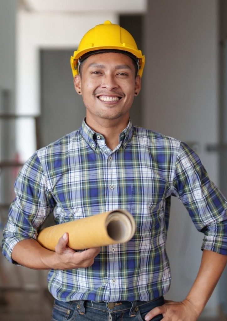 Hakkımızda 4 architect man working with blueprints for architectural plan engineer sketching a construction e1694073243258